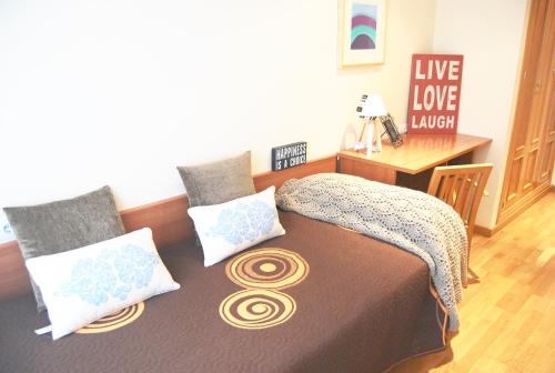 Posteľ alebo postele v izbe v ubytovaní Apartamentos Turisticos ARCH