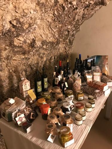 a table with a bunch of bottles of wine at Charme in Perillis in Popoli
