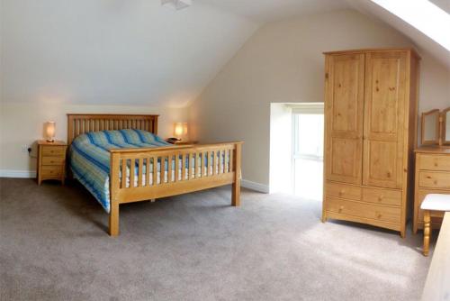 Uma cama ou camas num quarto em Brynheulwen