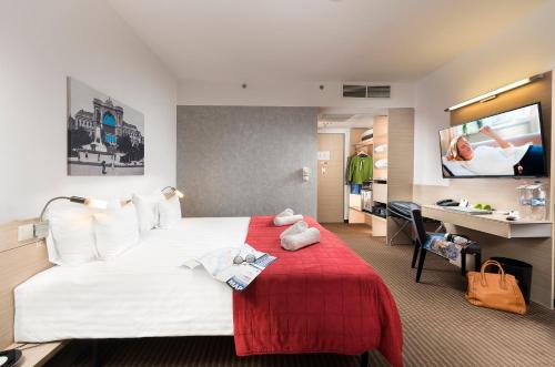 A bed or beds in a room at Bo18 Hotel Superior