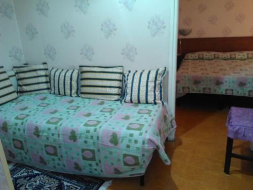 a bedroom with two beds in a room at Pensione Santachiara in Sanremo