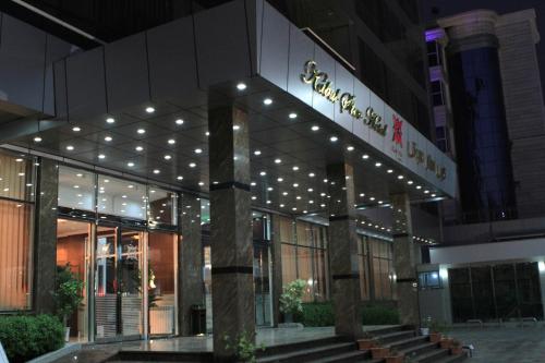 a building with a sign on the front of it at Kabul Star Hotel & Restaurant in Shīrpūr