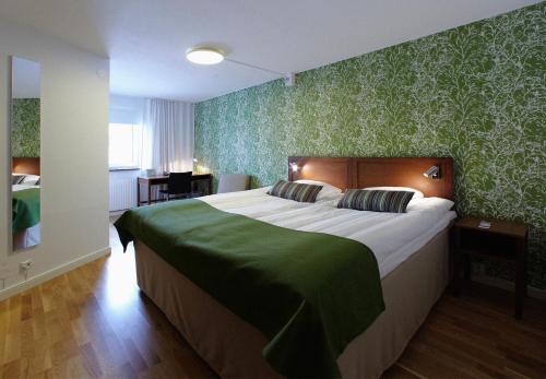 Postel nebo postele na pokoji v ubytování Hotell Conrad