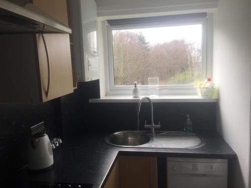 A kitchen or kitchenette at The Fairways 