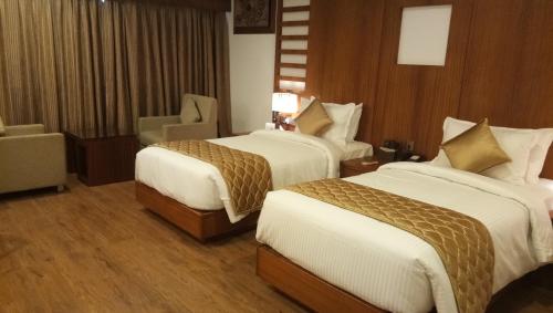 Hotel Karthika Parkにあるベッド