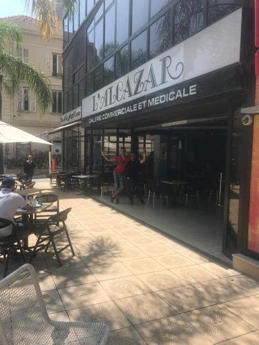 a restaurant with tables and chairs outside of a building at Monaco Studio "907" in Monte Carlo
