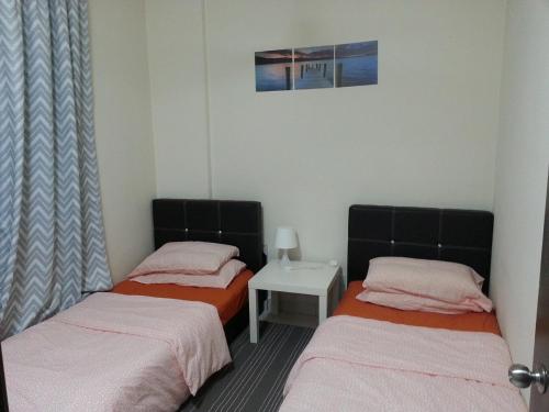 Postel nebo postele na pokoji v ubytování Ijanina Homestay