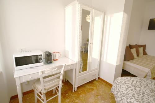 En eller flere senge i et værelse på Villa Mori