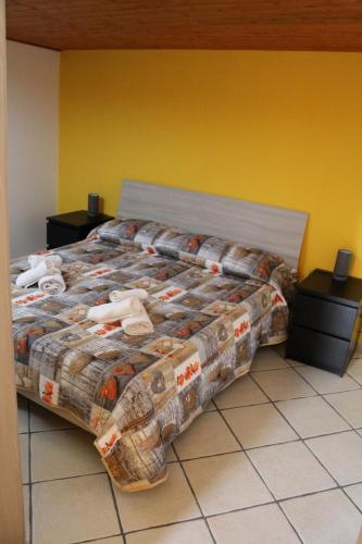 a bedroom with a bed with stuffed animals on it at Il Fortino in Catania
