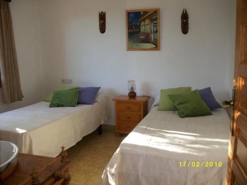 Postel nebo postele na pokoji v ubytování can guito es pujols-finca sa caleta , cp: 07818