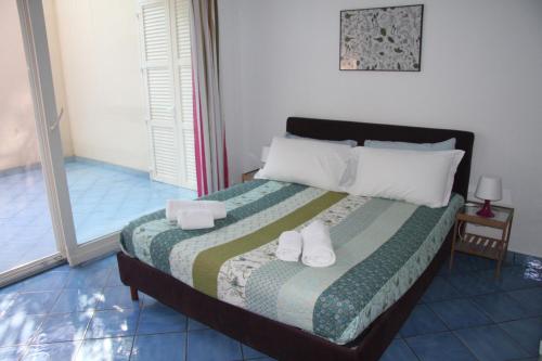 A bed or beds in a room at Destination Cefalu - your best view