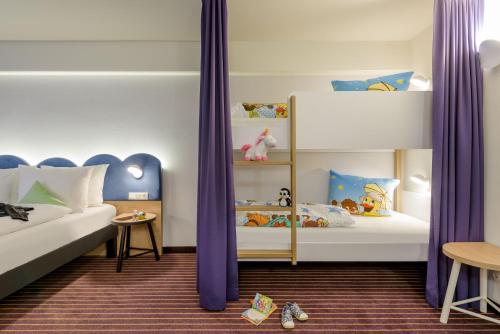 Кровать или кровати в номере ibis Styles Leipzig
