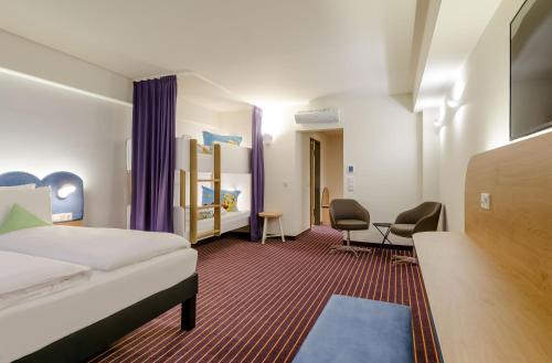 Кровать или кровати в номере ibis Styles Leipzig