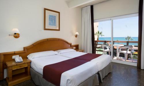 Postel nebo postele na pokoji v ubytování Hotel MS Tropicana