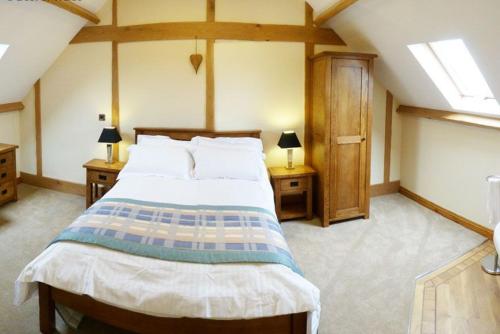 En eller flere senge i et værelse på Bwthyn Tre-faen