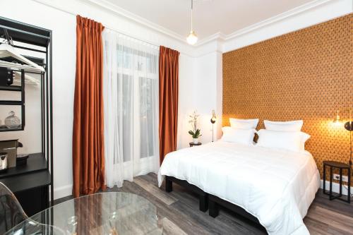 Postel nebo postele na pokoji v ubytování Arome Hotel