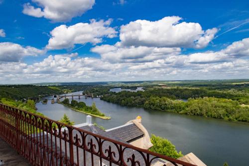 a view of a river from a balcony at Domaine De La Corniche in Rolleboise