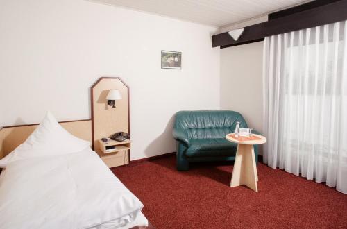 Postel nebo postele na pokoji v ubytování Hotel Abendroth