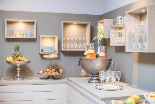 a kitchen with a counter with wine glasses on it at Hotel-Restaurant Birkenhof in Bad Soden-Salmünster