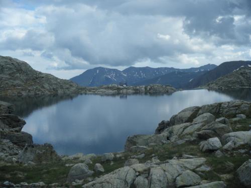 a lake in the middle of a mountain range at Amaroq Explorers BaseCamp in Tremp