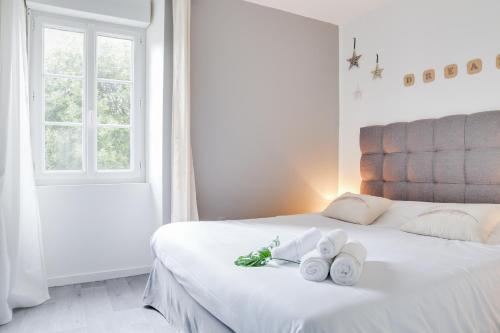 Ένα ή περισσότερα κρεβάτια σε δωμάτιο στο Osemae Immobilier - Redon Port-Chatelêt