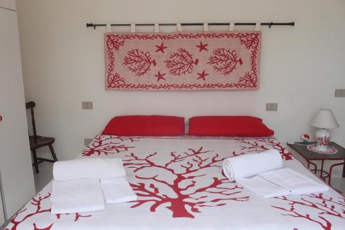 Een bed of bedden in een kamer bij La Lampara