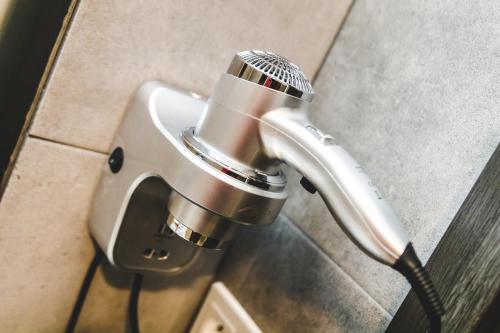 a microphone in a holder in a bathroom at SILESIA Apartment in Ostrava