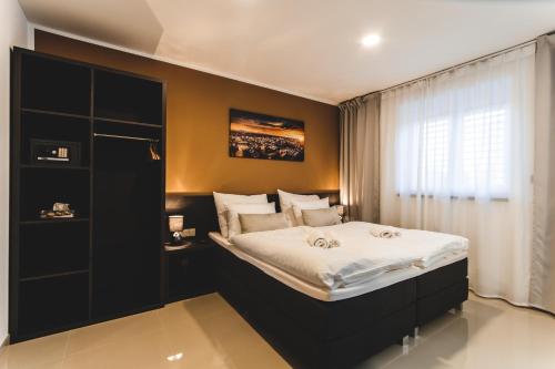 Ένα ή περισσότερα κρεβάτια σε δωμάτιο στο SILESIA Apartment