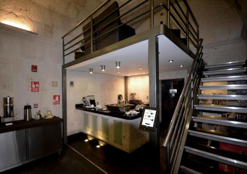 a room with a staircase and a counter in a building at qp Hotels Arequipa in Arequipa