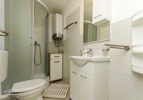 a bathroom with a toilet sink and a shower at Apartment Mirjana in Rogoznica