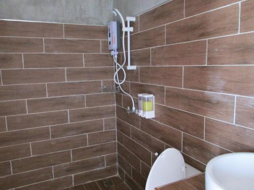 a bathroom with a toilet and a shower at Norn Nab Dao Rimkhong in Chiang Khan