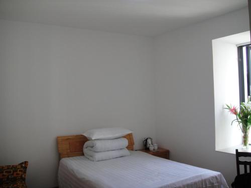Uma cama ou camas num quarto em Hefei Vanward Fashion Short Rent