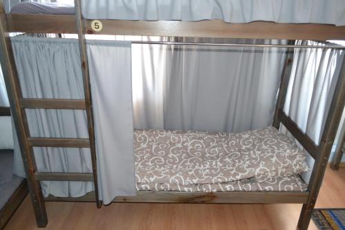 a bunk bed with a pillow on the bottom bunk at Maverick in Ternopilʼ