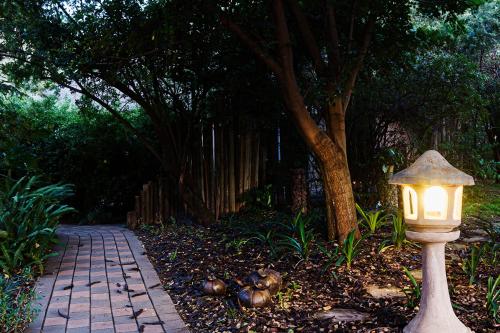 a light on a pole next to a path at Glenda's Guest Suites in Midrand