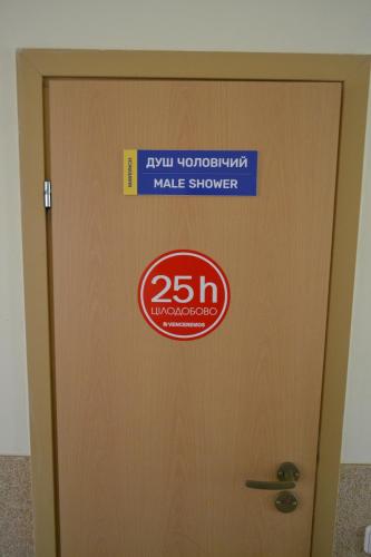 a sign on a door in a building at Maverick in Ternopilʼ