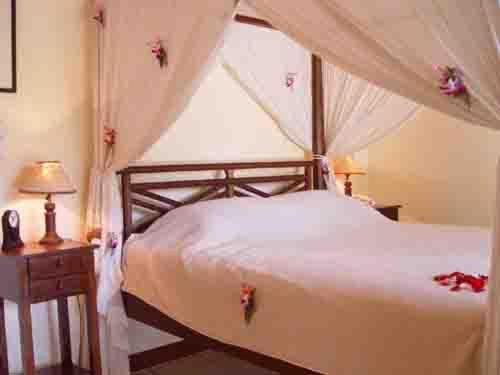 Giường trong phòng chung tại Bali Golden Villas