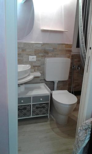 a bathroom with a toilet and a sink at Agriturismo Nonni Devia in Lucinasco