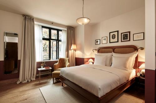 מיטה או מיטות בחדר ב-Hotel Sanders