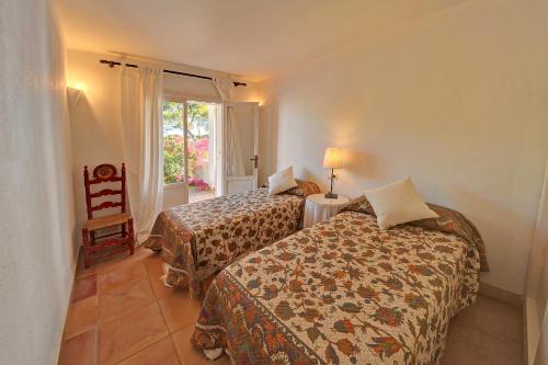 Katil atau katil-katil dalam bilik di Villa Vistamar