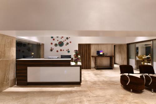 The lobby or reception area at Hotel Leafio Marigold-Near Airport