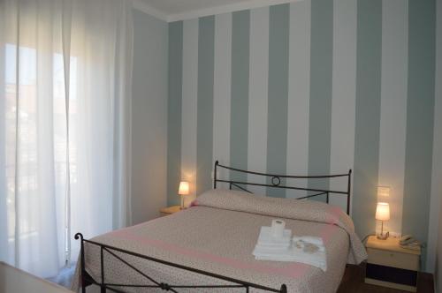 Una cama o camas en una habitación de Hotel Bianchi Nicola