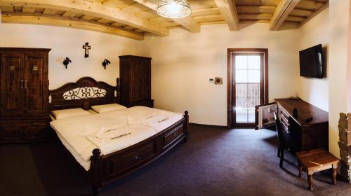 Posteľ alebo postele v izbe v ubytovaní Apartmány pod Oravským hradom