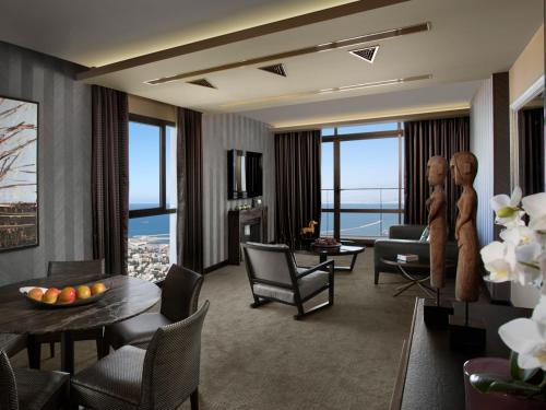 a living room with a view of the city at Dan Carmel Haifa in Haifa