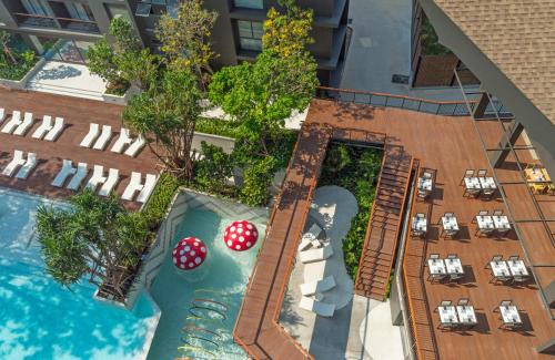 an overhead view of a swimming pool with two poker tables at Panan Krabi Resort in Ao Nang Beach