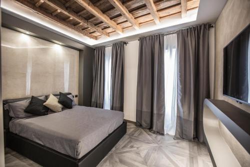 a bedroom with a bed and a large window at DaVinci Apartament near Duomo in Milan
