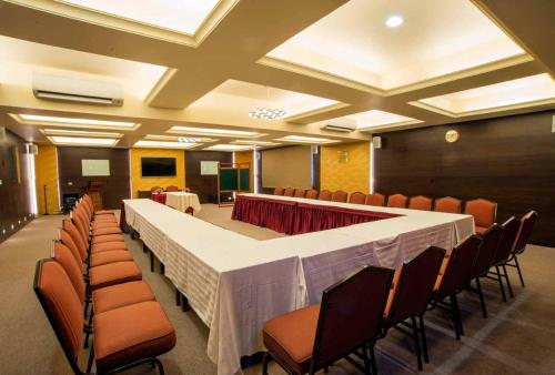 a large conference room with a long table and chairs at YMCA International House in Mumbai