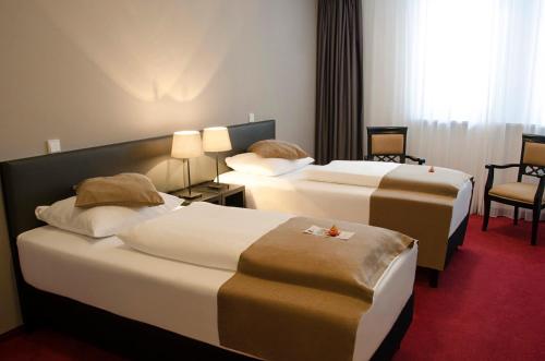 Ένα ή περισσότερα κρεβάτια σε δωμάτιο στο The Corner Hotel