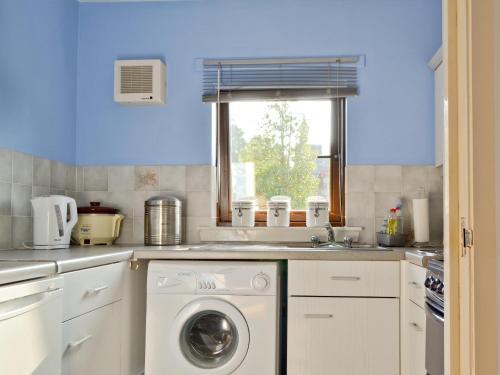 A kitchen or kitchenette at Ancaster Apartment 