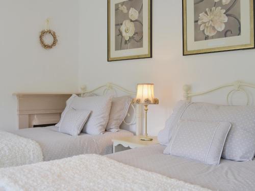 A bed or beds in a room at Little Burwood 