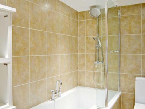 A bathroom at The Annex At Mitchells Cottage 